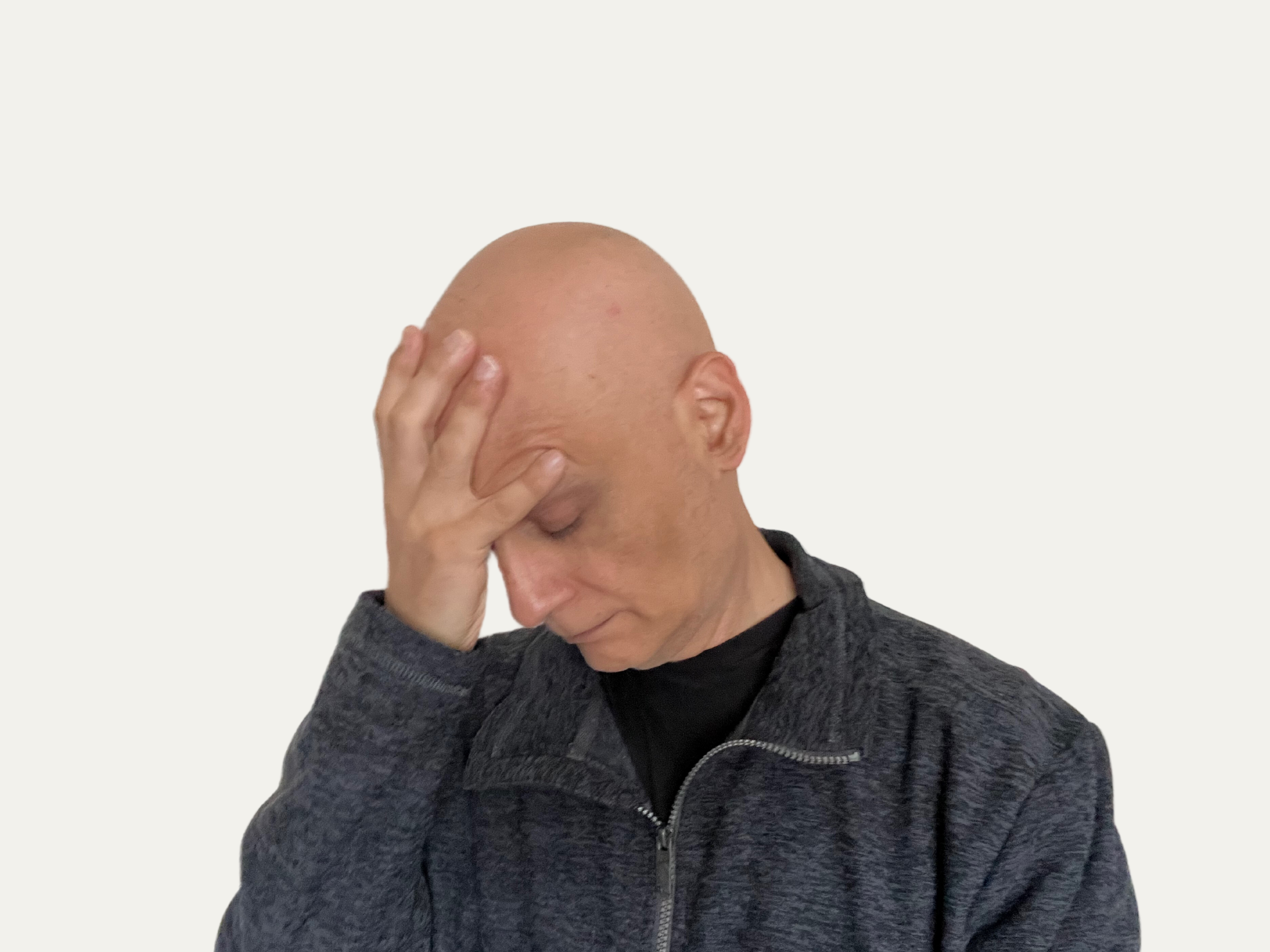 Man holding head in frustration